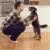 Photo of man talking to his dog
